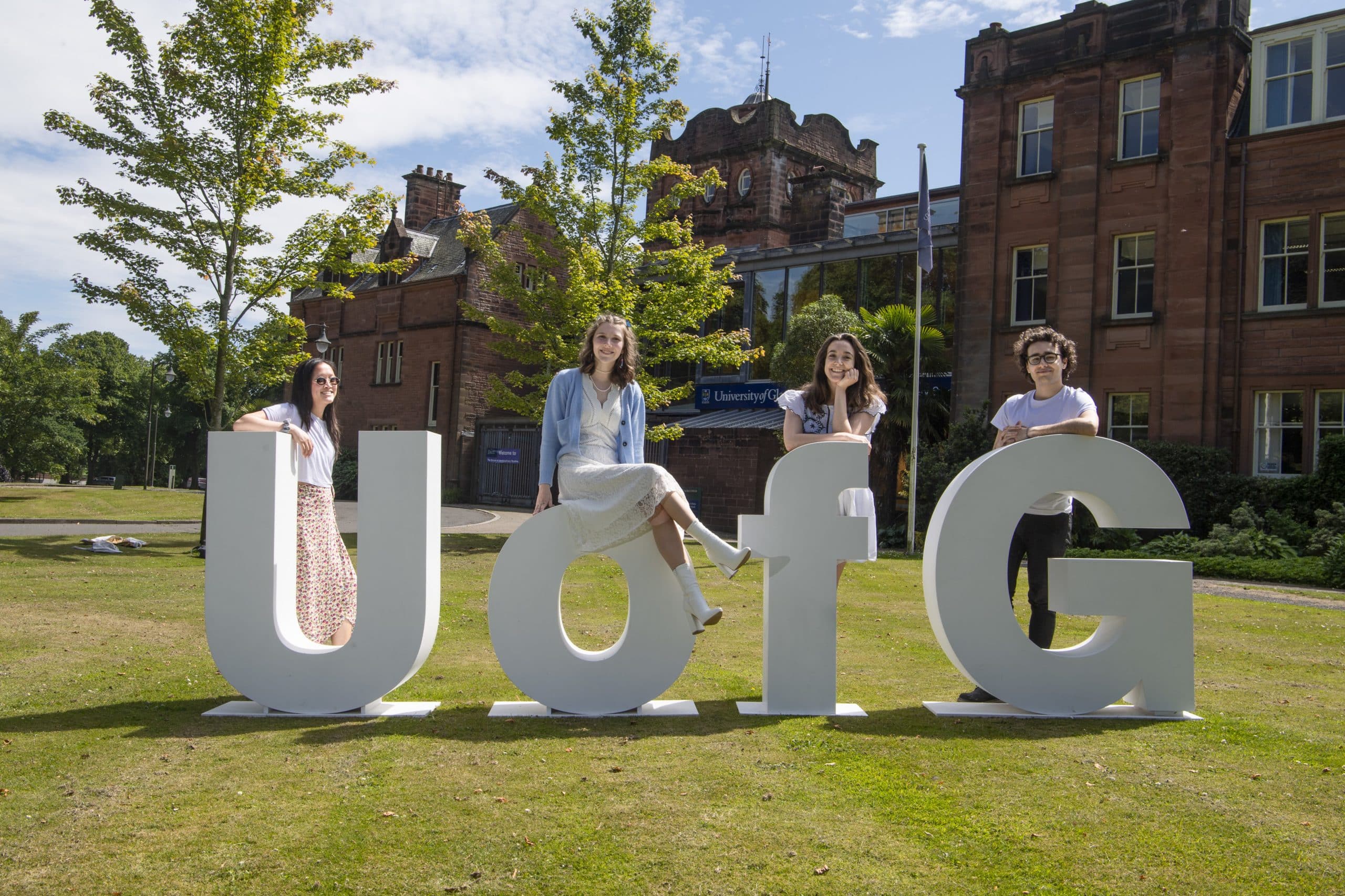 Students outside the Rutherford/McCowan Building at Dumfries Campus